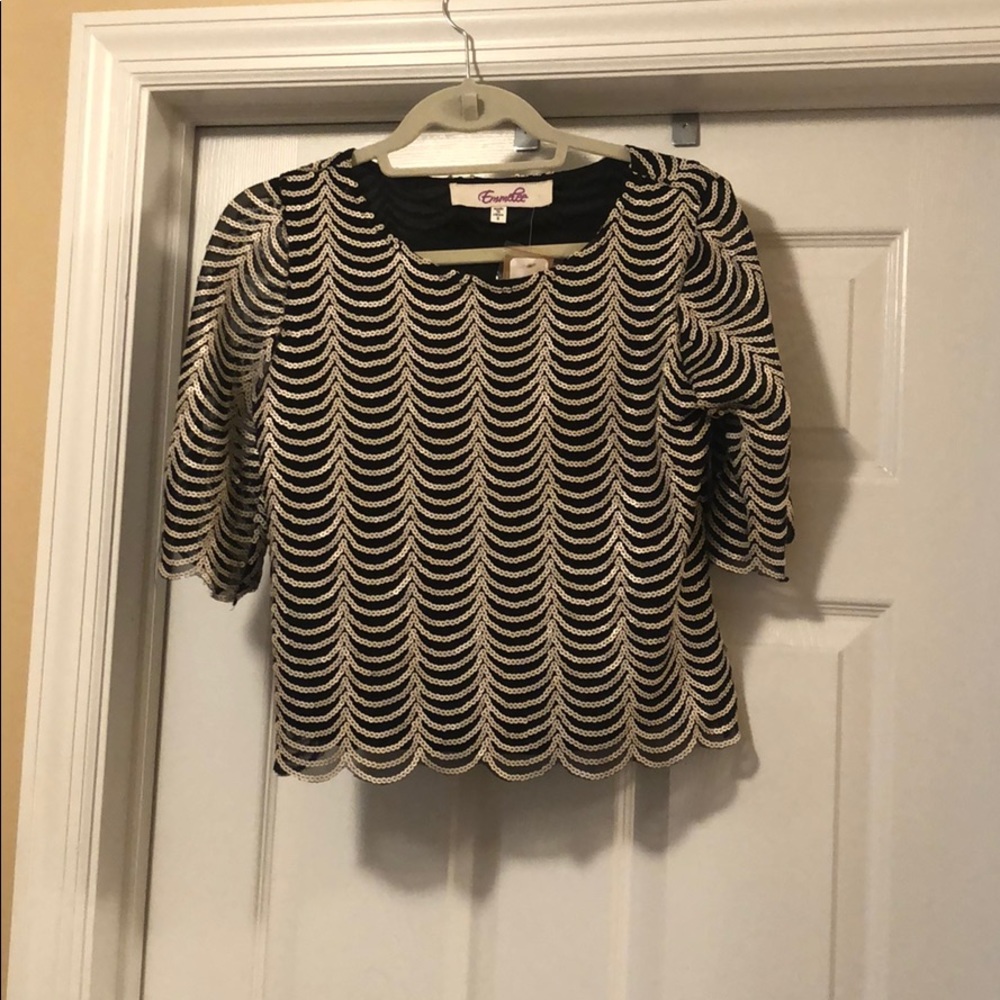 Francesca’s sequined blouse